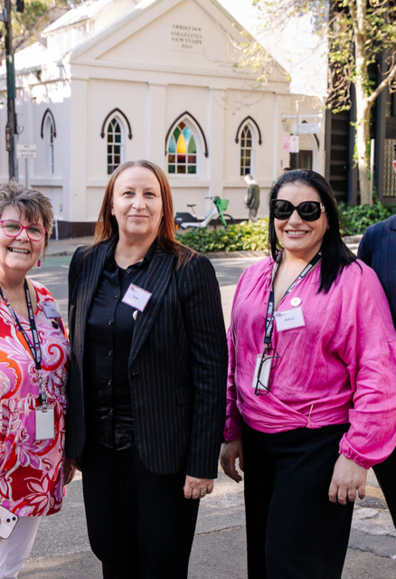 Mission Australia Centre Surry Hills team stands together on the street for the 50th anniversary.